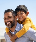 Dad with child on shoulders